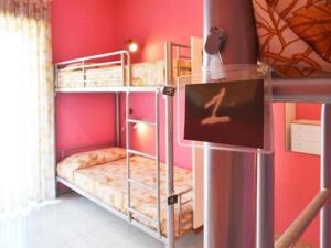 Postel nebo postele na pokoji v ubytování Gianni House Backpackers Hostel