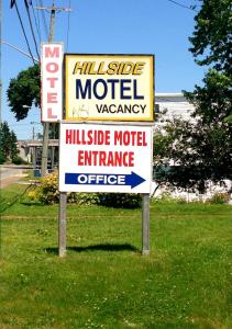 a sign for a motelagencyasteryasteryasteryasteryasteryasteryasteryasteryasteryastery at Hillside Motel in Saint John