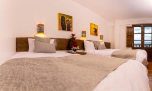 Postel nebo postele na pokoji v ubytování Hotel Rumi Punku + 59 fotografií