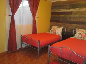 Giường trong phòng chung tại Casa TINY