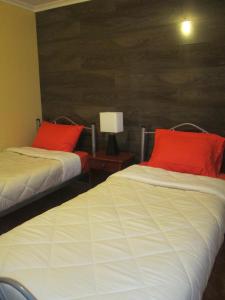 Giường trong phòng chung tại Casa TINY
