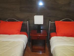 Giường trong phòng chung tại Casa TINY