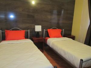 Giường trong phòng chung tại Casa TINY