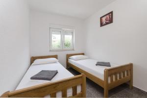 Postel nebo postele na pokoji v ubytování Apartments Crystal