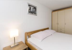 Postel nebo postele na pokoji v ubytování Apartments Crystal