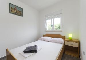 Postel nebo postele na pokoji v ubytování Apartments Crystal