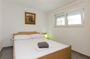 Postel nebo postele na pokoji v ubytování Apartments Crystal
