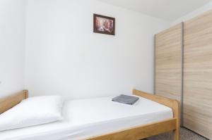Postel nebo postele na pokoji v ubytování Apartments Crystal