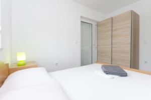 Postel nebo postele na pokoji v ubytování Apartments Crystal