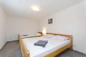 Postel nebo postele na pokoji v ubytování Apartments Crystal