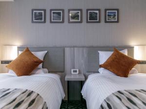 Letto o letti in una camera di Hotel Mystays Kagoshima Tenmonkan Annex