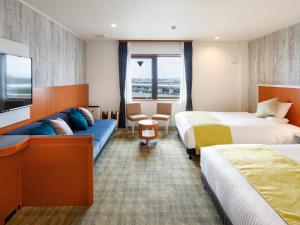 Postel nebo postele na pokoji v ubytování HOTEL MYSTAYS Maihama