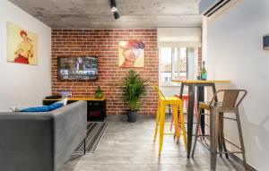 a living room with a brick wall at Orion apartment in Poreč