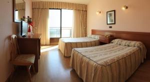 Posteľ alebo postele v izbe v ubytovaní Hotel Alfar