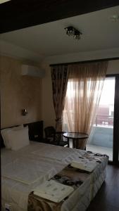 Postel nebo postele na pokoji v ubytování Taai Hotel