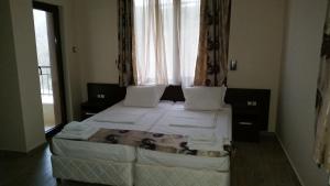 Postel nebo postele na pokoji v ubytování Taai Hotel + 21 fotografií