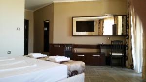 Postel nebo postele na pokoji v ubytování Taai Hotel