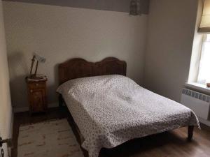 Postel nebo postele na pokoji v ubytování Kreutzwaldi Apartement