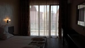 Postel nebo postele na pokoji v ubytování Taai Hotel