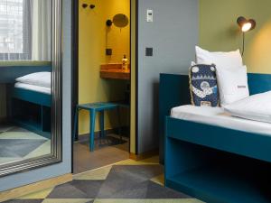 Cama ou camas em um quarto em 25hours Hotel The Trip