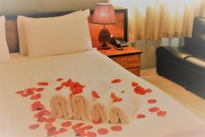 Postel nebo postele na pokoji v ubytování Byblos Comfort Hotel