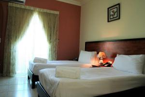 Postel nebo postele na pokoji v ubytování Byblos Comfort Hotel