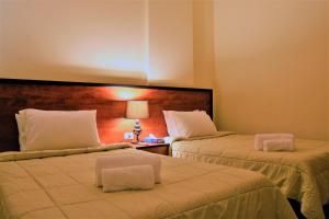 Postel nebo postele na pokoji v ubytování Byblos Comfort Hotel