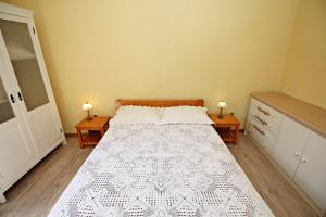 Postel nebo postele na pokoji v ubytování Filipi Apartment