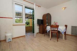 TV a/nebo společenská místnost v ubytování Filipi Apartment