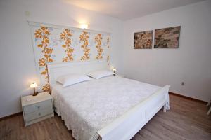Postel nebo postele na pokoji v ubytování Filipi Apartment