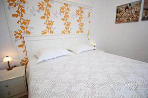Postel nebo postele na pokoji v ubytování Filipi Apartment
