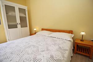 Postel nebo postele na pokoji v ubytování Filipi Apartment