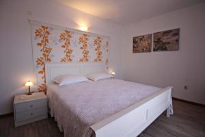 Postel nebo postele na pokoji v ubytování Filipi Apartment