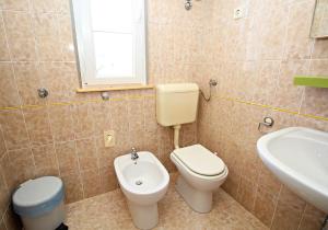 Koupelna v ubytování Filipi Apartment + 15 fotografií