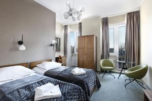 Postel nebo postele na pokoji v ubytování Hotel Dom Marynarza