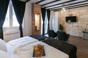 TV a/nebo společenská místnost v ubytování Luxury Rooms Dino