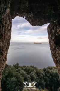 a view of a large body of water from a rock formation at Hotel Italia & Lombardi in Montefiascone