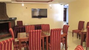 A restaurant or other place to eat at Regency Mount Kenya Hotel