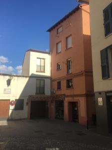 a group of buildings on a street at Apartamentos Turisticos Sol y Nieve in Jaca