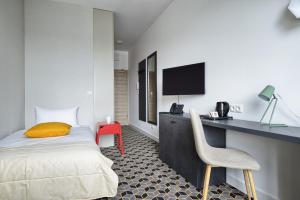 Łóżko lub łóżka w pokoju w obiekcie Arche Hotel Poloneza