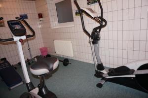 a room with a hair dryer and a barber chair at Paradies 503 in Arosa