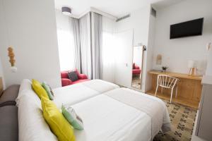 Posteľ alebo postele v izbe v ubytovaní Hotel Catalina