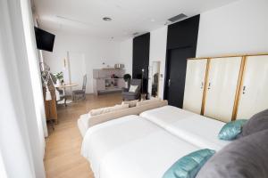 Posteľ alebo postele v izbe v ubytovaní Hotel Catalina
