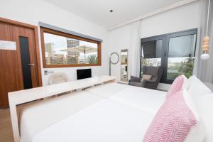 Posteľ alebo postele v izbe v ubytovaní Hotel Catalina