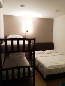 Postel nebo postele na pokoji v ubytování Coral Home 珊瑚之家