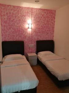 Postel nebo postele na pokoji v ubytování Coral Home 珊瑚之家