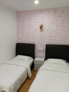 Postel nebo postele na pokoji v ubytování Coral Home 珊瑚之家