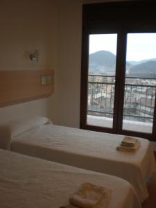 Postel nebo postele na pokoji v ubytování Hostal Sant Bernat