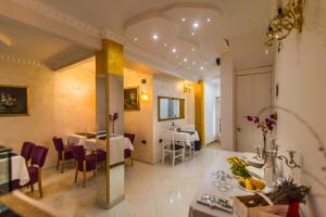 a restaurant with two tables and a dining room at Bella Natka Bed and Breakfast in Rovinj