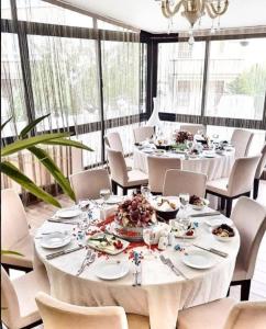 a dining room table filled with plates of food at City Hotel Residence in Ankara